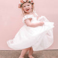 Cove spinning around in the Grace Linen Tulle High Low Dress