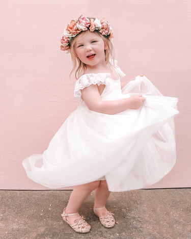 Cove spinning around in the Grace Linen Tulle High Low Dress
