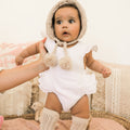 Baby Girls Layla White Muslin Ruffle Romper Fawn Pom Pom Beanie Socks